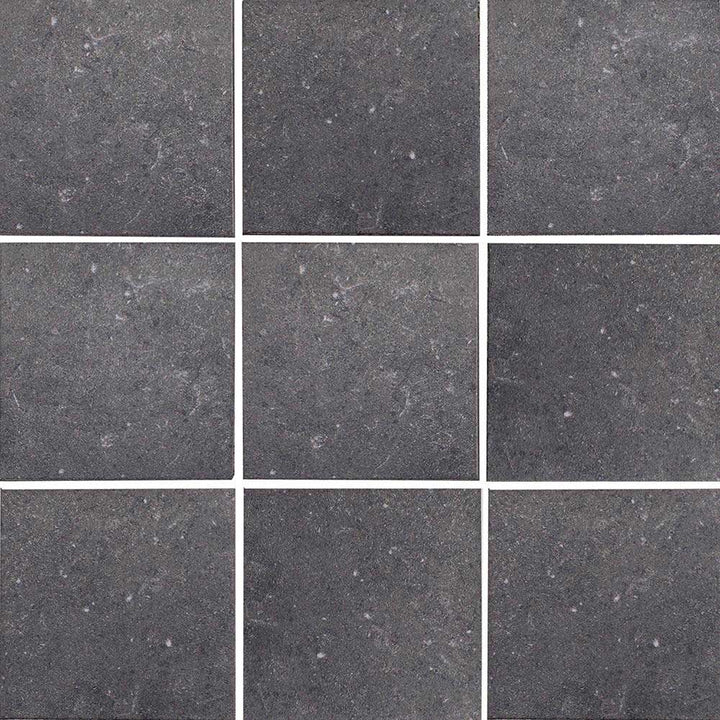 Nine square tiles of dark gray stone with a subtle pattern.