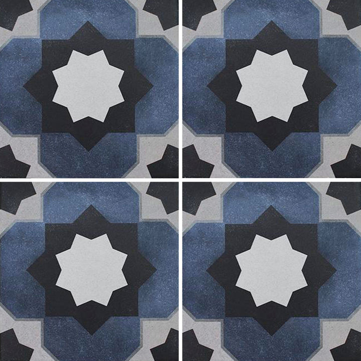 Aquatica Fleur Series 6x6 porcelain pool tile with a star-shaped geometric pattern in blue, white, gray, and charcoal tones, shown in a repeating layout.
