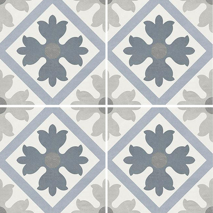 6x6 Aquatica Flore Series porcelain pool tile with decorative floral pattern in soft blue, gray, and white tones for pools and spas