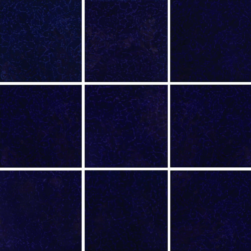 Nine square tiles of dark blue color with a subtle pattern.