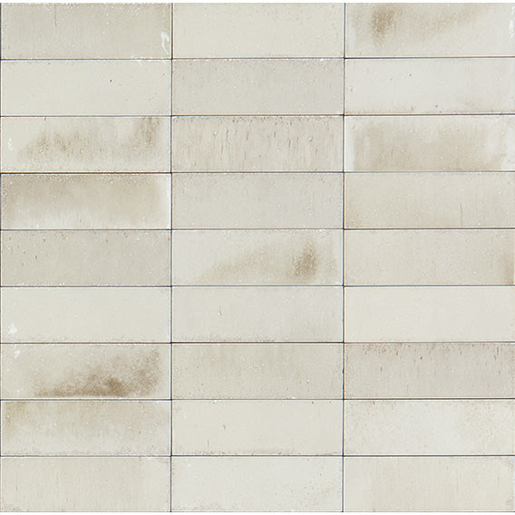 Beige tiles with a subtle pattern on a white background
