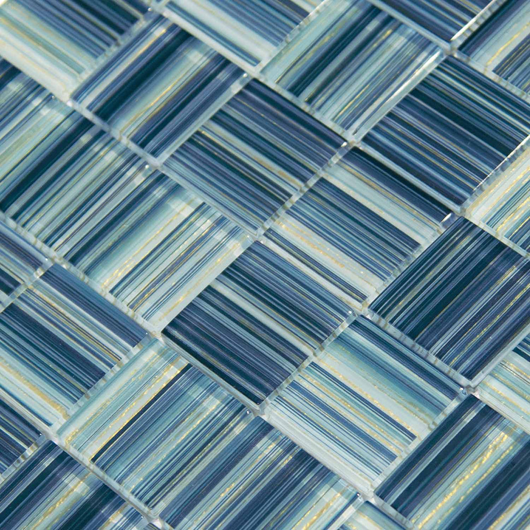 Pattern of blue and green tiles arranged in a herringbone style.