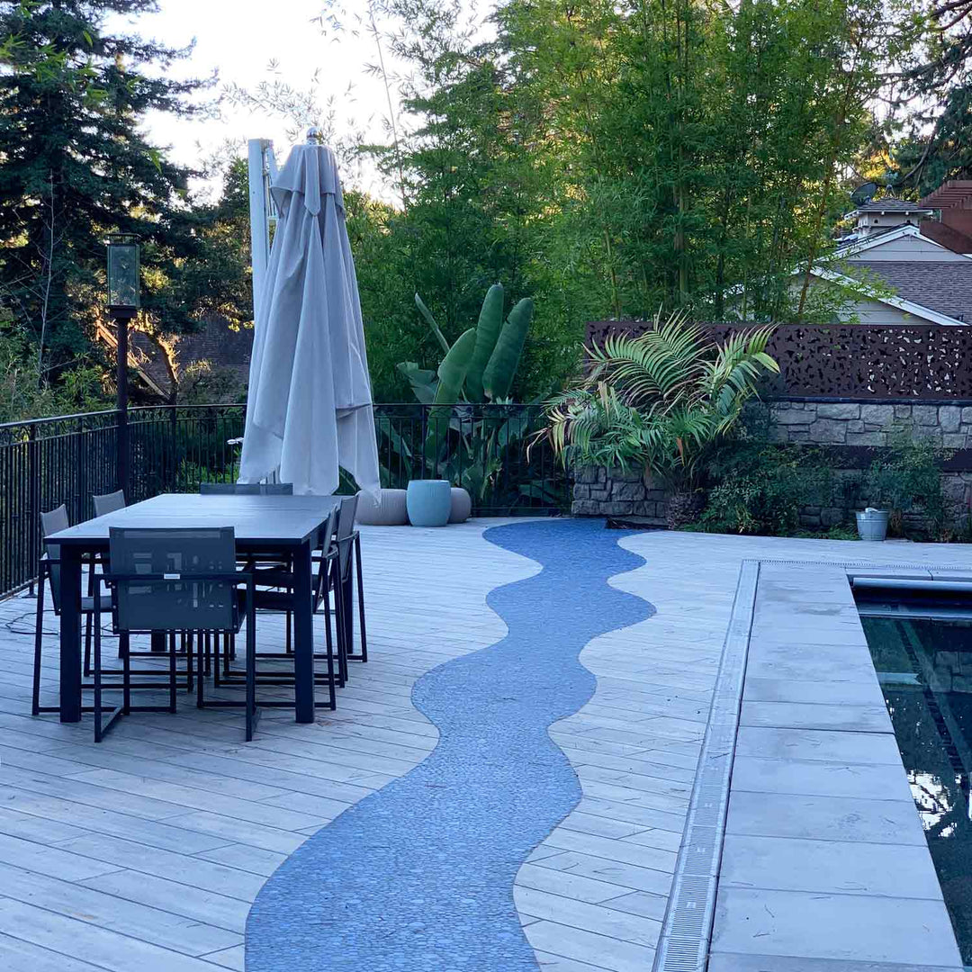 Jade Blue Pebble Stone Installed on Walkway Next to Pool