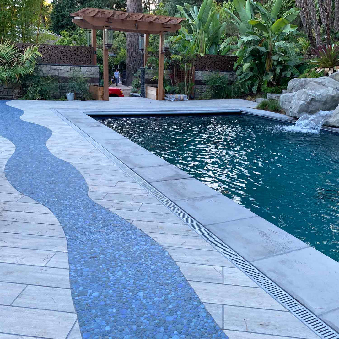 Jade Blue Pebble Stone Installed on Walkway Next to Swimming Pool