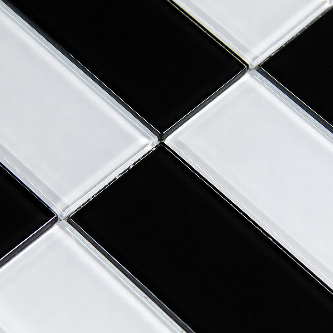 Black and white glossy mosaic glass tiles arranged in a diagonal checkerboard pattern.