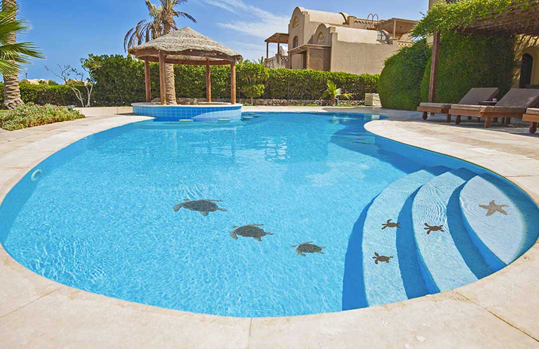 Pool with turtle designs and a gazebo in a residential area