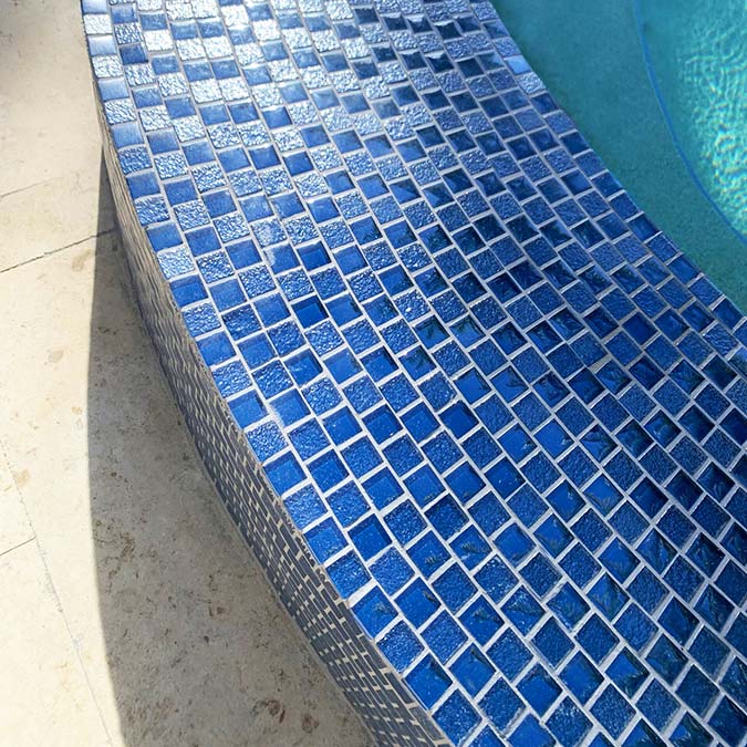 Lustrous Blue 1x1 Glass Tile Mosaics Installed on Top of Spa