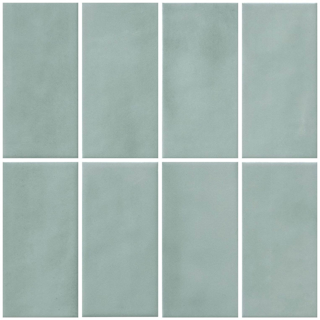 Eight rectangular ceramic tiles in a uniform sage green color