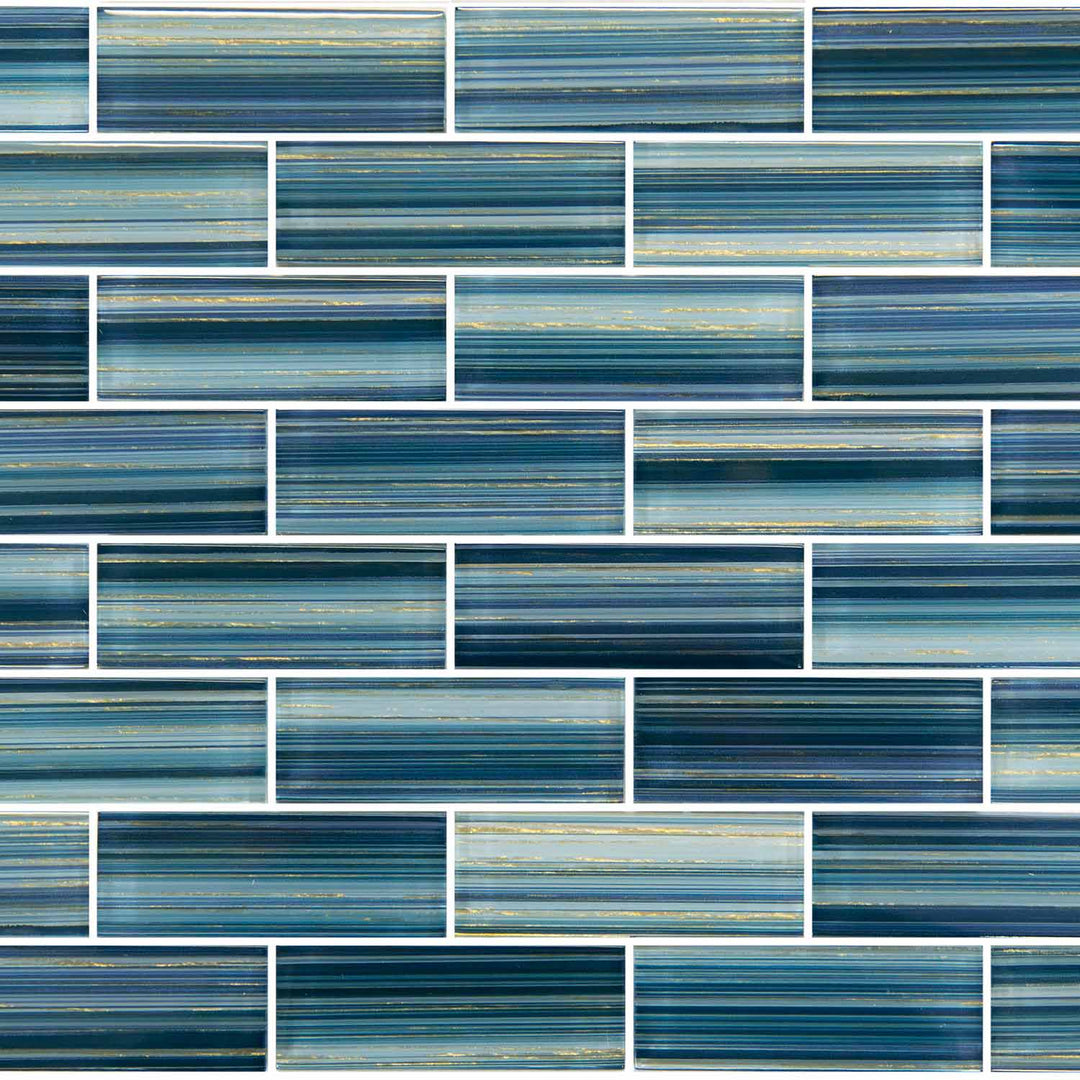Blue and teal subway mosaic tile pattern with horizontal textured strips and white grout lines.