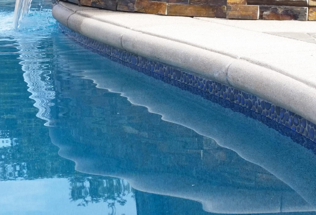 Royal Blue Glossy Porcelain Tile Installed Around the Swimming Pool