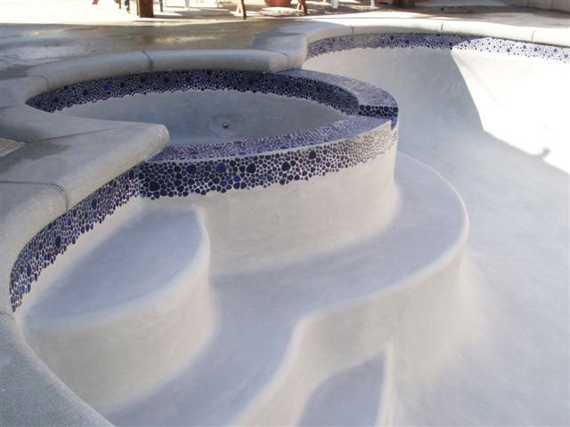 Royal Blue Pebble Stone Installed Around the Pool