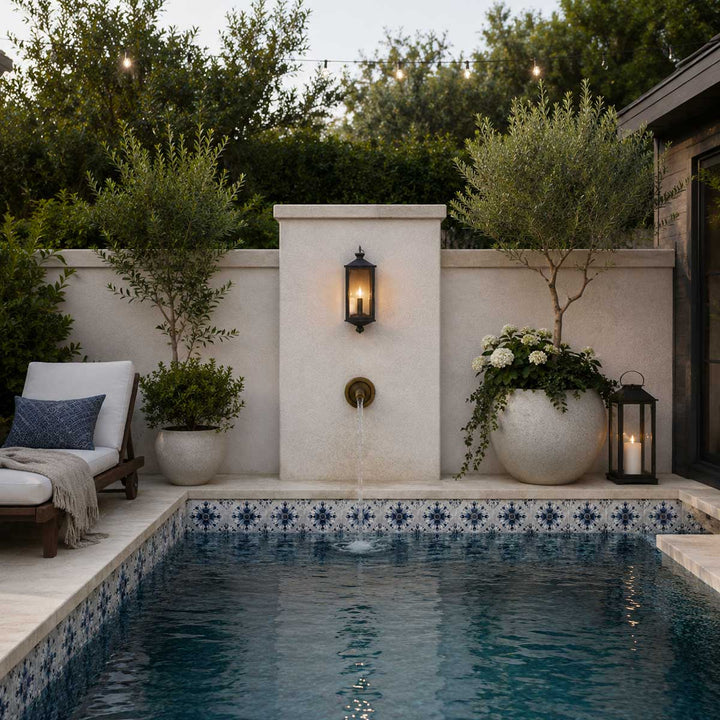 Serene Mediterranean courtyard pool at dusk Cayman Blue tile
