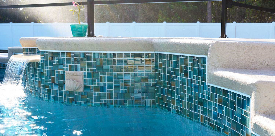 Aquamarine Blend MIxed Glass Tile on Waterline Raised Wall and Spillway