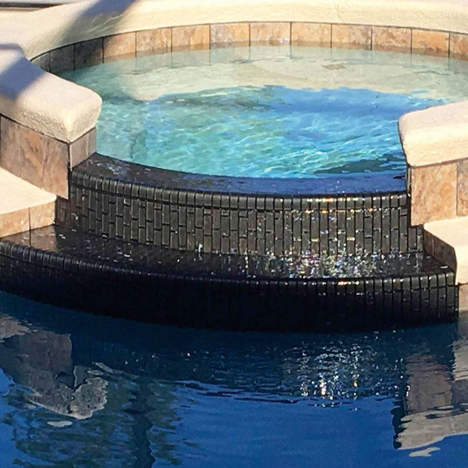 Eclipse Iridescent 1″ x 1″ Glass Pool Tile on Spillway Spa
