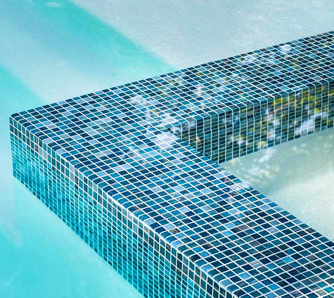 Pacific Blue Rust 3/4 inch x 3/4 inch Glass Pool Tile Installed on the Spa